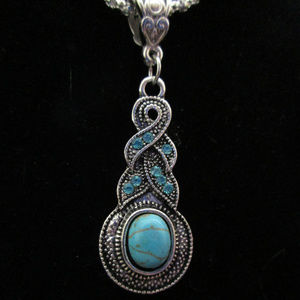 264 Faux turquoise & blue crystal swirl pendant